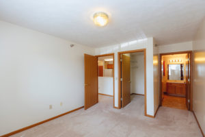 Bedroom and bathroom inteior in Sunburst Floorplan: 2 bedroom 972 sq ft