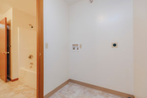 Laundry room in Sunset Floorplan: 1 bedroom with den